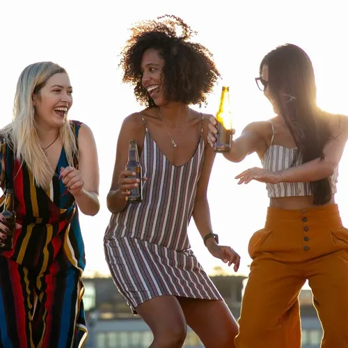 Friends celebrating outdoors in the community